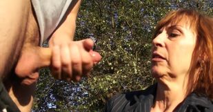 Mature redhead gives head in public and likes being taped