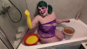 Clown girl gets wet and slimy
