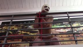 bound to a railing in fishnet pantyhose and heels you can see my beautful tits and ass while i have mouth and pussy fucked