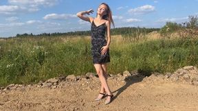 A girl in beautiful new shoes decides to walk off-road with sticky mud