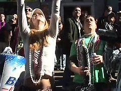 Babes having fun in Mardi Gras flash their tits at the crowd