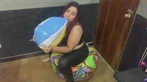 I inflate a 51cm beach ball until it explodes sitting on a 71cm one