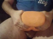 Masturbating with the fake pussy toy