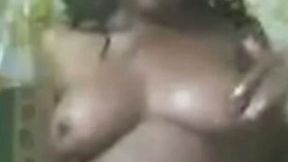 Thick African cam whore flaunts her fat hairy pussy and tits