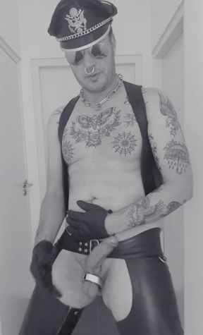 Leatherstudx in very tight leatherchaps, tattooed, pierced and a big cock!