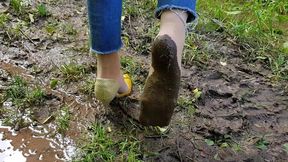 One shoe and dirty nylon feet, walking barefoot in mud, muddy nylon feet