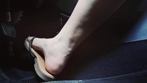 adorable pedal pumping in flip flops and bare feet