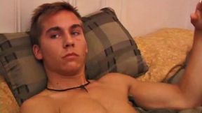 After storing his load for about a week, Brock is back to stroke one out for us. He makes himself at home on the bed, strips naked, and starts working his dick.
