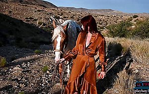 Redhead MILF babe Odette loving the outdoors and gets naked in it