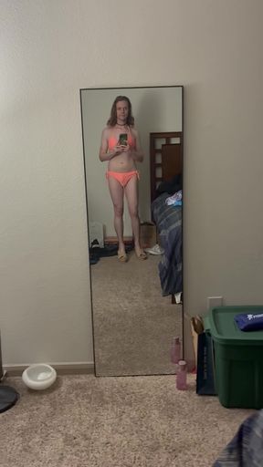 Crossdresser in heels shows off her bikini body while flexing her