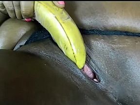Ebony MILF fucking herself with various stuff
