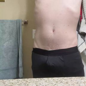 Sexy jock gets ready for a shower and pees