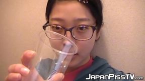 Sweet Japanese girl uses the toilet and collects urine