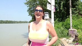 German scout with massive swinging tits talks dirty outside for cash at pickup casting