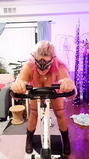 Beautiful blonde slut rides and sucks on exercise bike