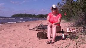 naughty milf is having fun at a picnic - sits pussy on a bottle of lemonade