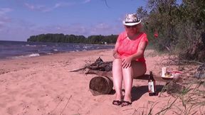 naughty milf is having fun at a picnic - sits pussy on a bottle of lemonade
