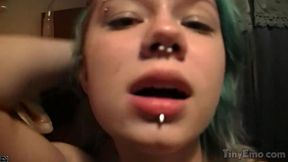 Tiny emo girl shows off her piercings in a webcam striptease while jacking