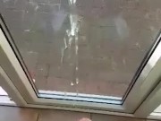 Shooting a huge load against the window